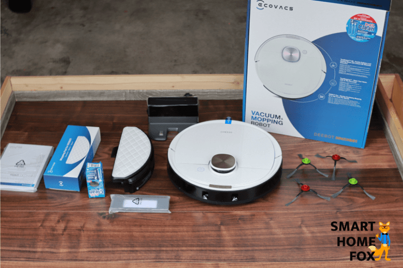 Der gesamte Lieferumfang des Ecovacs Deebot T8 steht auf dem Boden